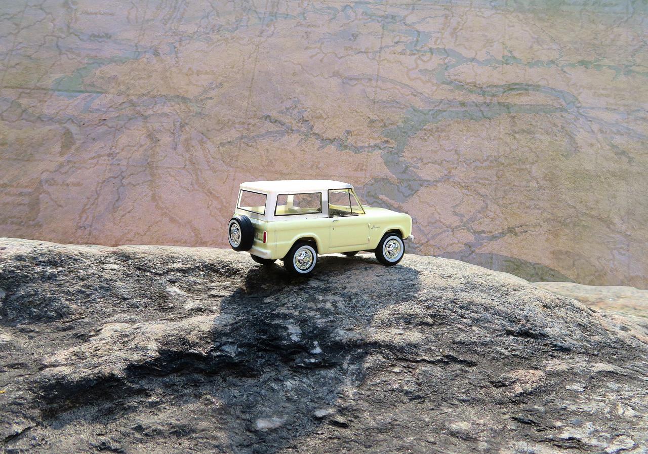 Toy Bronco on Cliff overlooking map of Utah