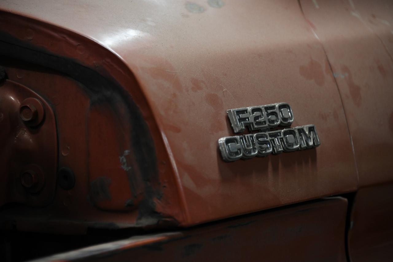 Close up of F250 Custom Emblem on Classic Brown Cab